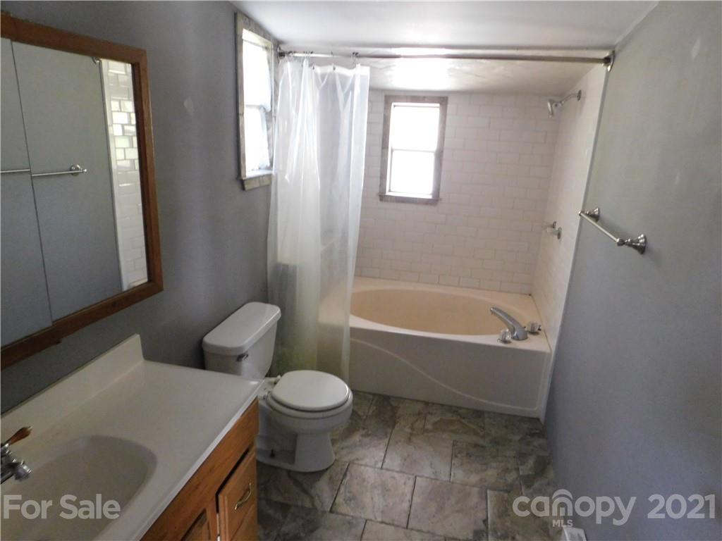 110 Blue Ridge Road Campobello, SC 29322 - Photo 20 of 26 a bathroom with a sink toilet and shower