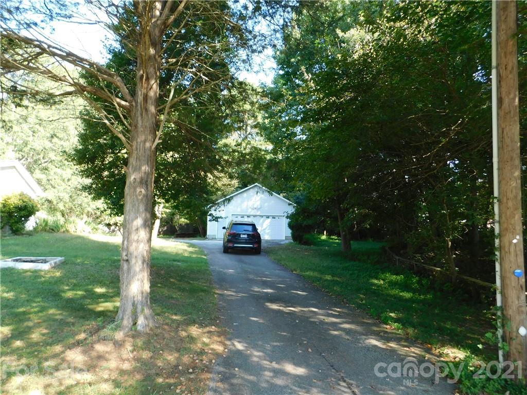 110 Blue Ridge Road Campobello, SC 29322 - Photo 5 of 26 a house with trees in the background