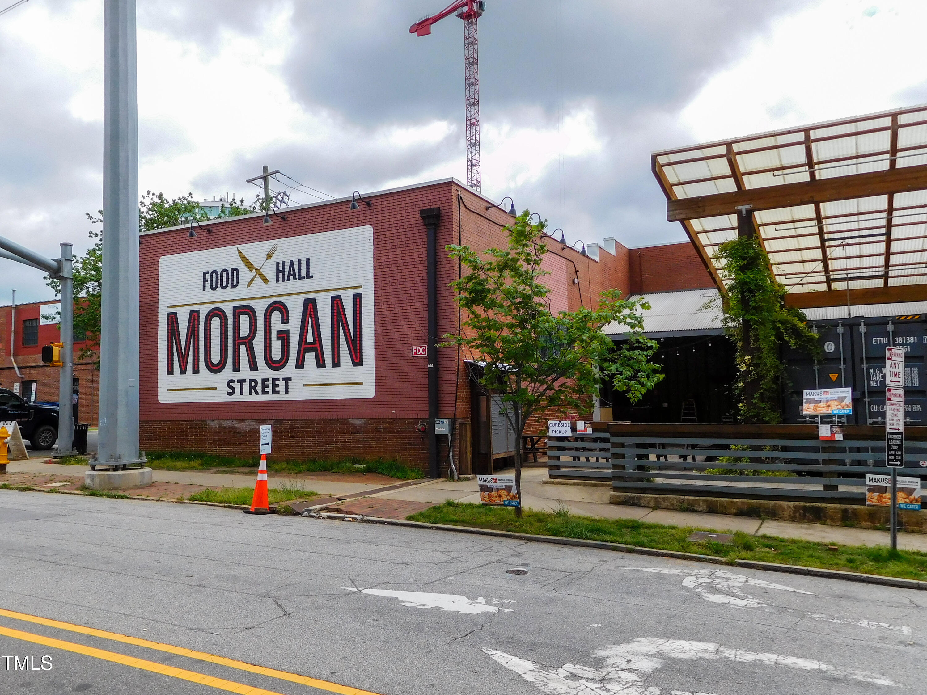 1317 Pender Street Raleigh, NC 27610 - Photo 15 of 16 a sign on the side of a street