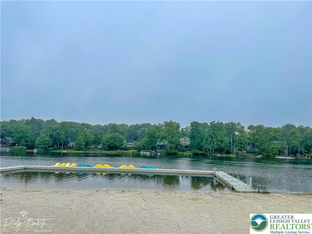 a view of a backyard with a lake view