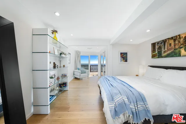 a bed room with a bed and a walk in closet