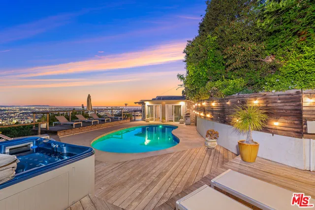 a view of a swimming pool with a lounge chairs