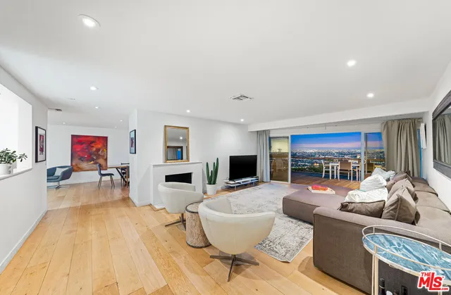 a kitchen with stainless steel appliances a refrigerator sink and stove