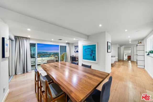 a view of a hallway with paintings on the wall