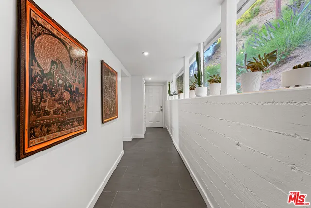 a view of a chairs and table in a balcony