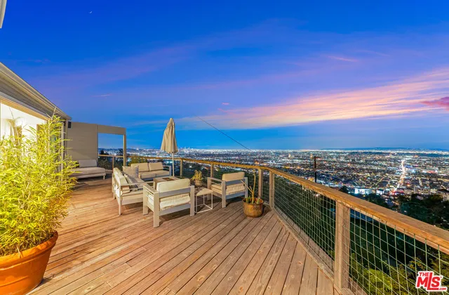 a view of a patio with a table and chairs