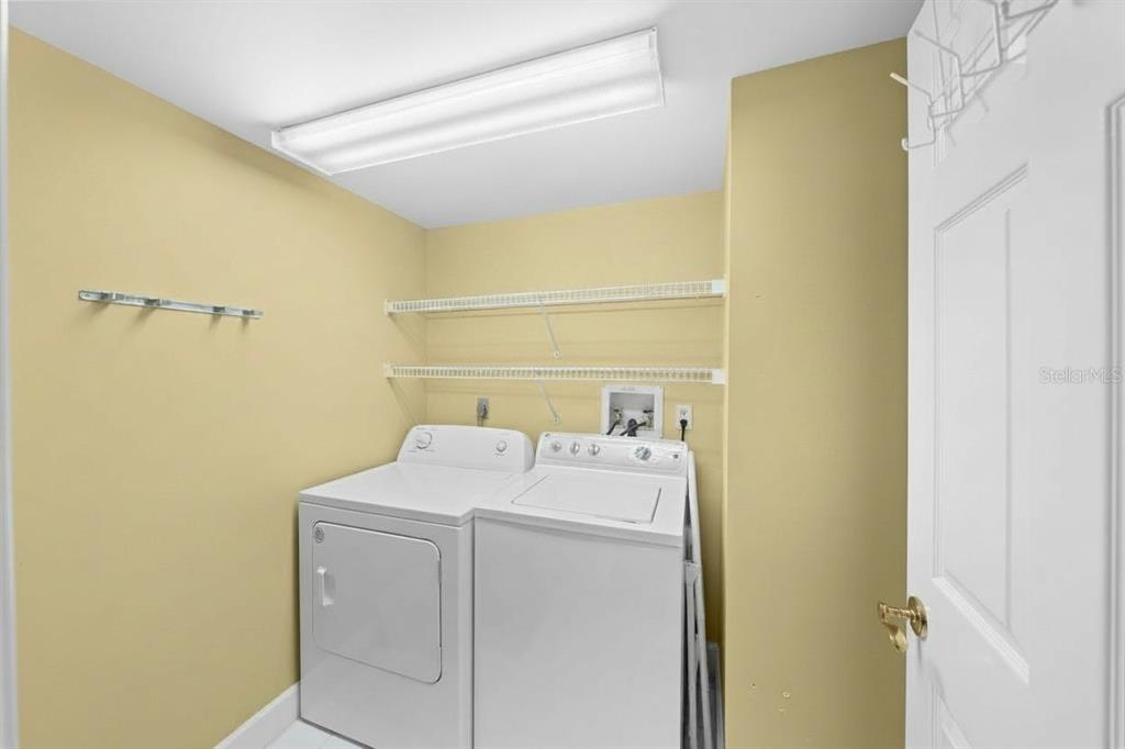 4575 South Atlantic Avenue, Unit 6209 Ponce Inlet, FL 32127 - Photo 23 of 31 a utility room with dryer and washer