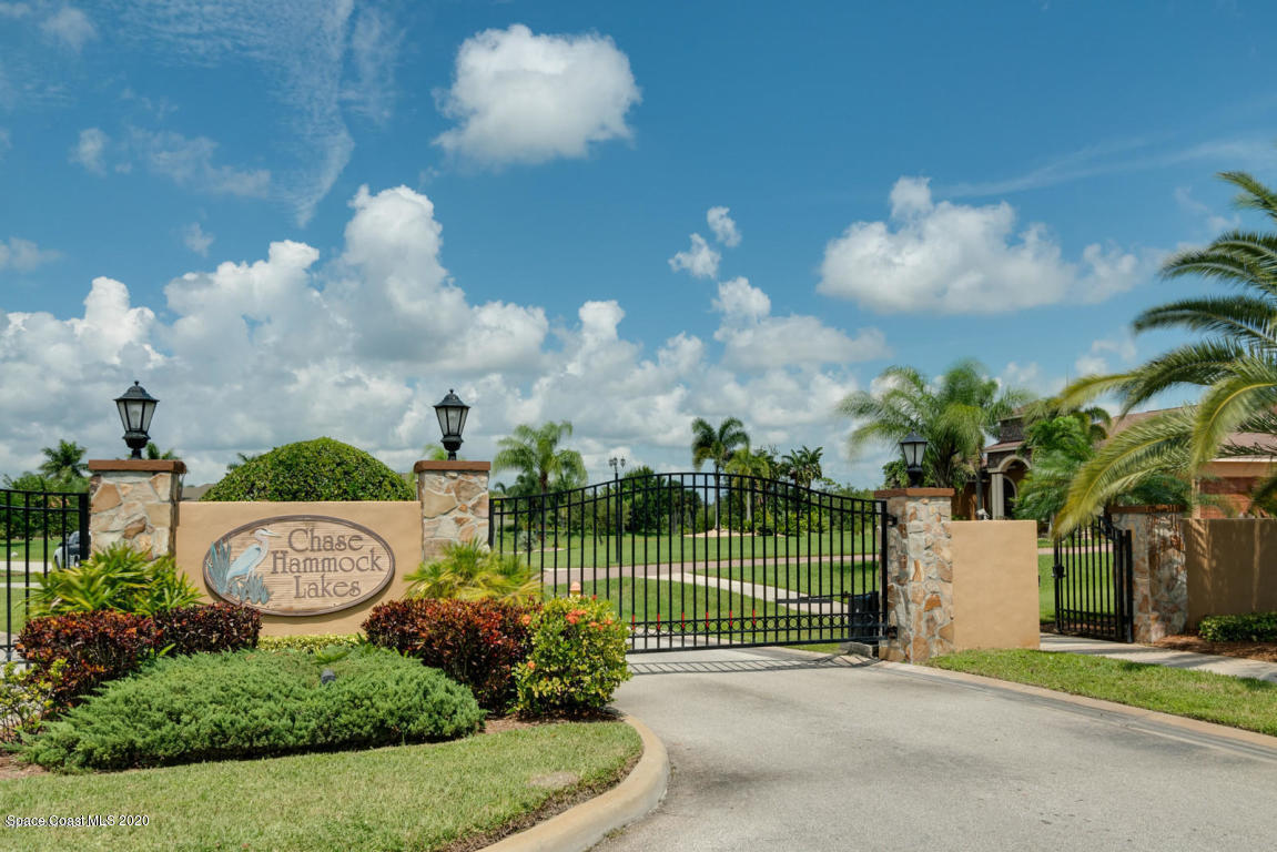 5236 Royal Paddock Way Merritt Island, FL 32953 - Photo 2 of 5 a view of a house with a flower garden