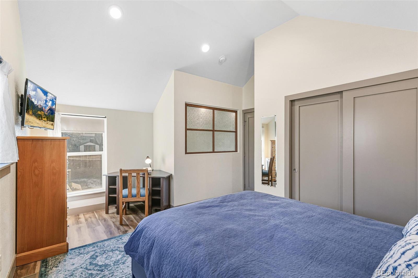 3885 Wolff Street Denver, CO 80212 - Photo 39 of 50 a view of a bedroom with furniture and window