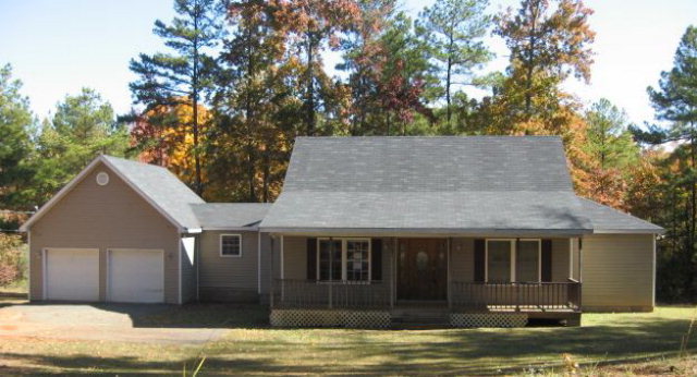 4134 Upper River Road Gray, GA 31032 - Photo 1 of 1 a front view of a house with a yard
