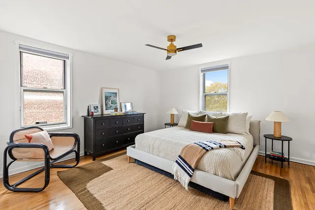 a kitchen with stainless steel appliances white cabinets and a refrigerator
