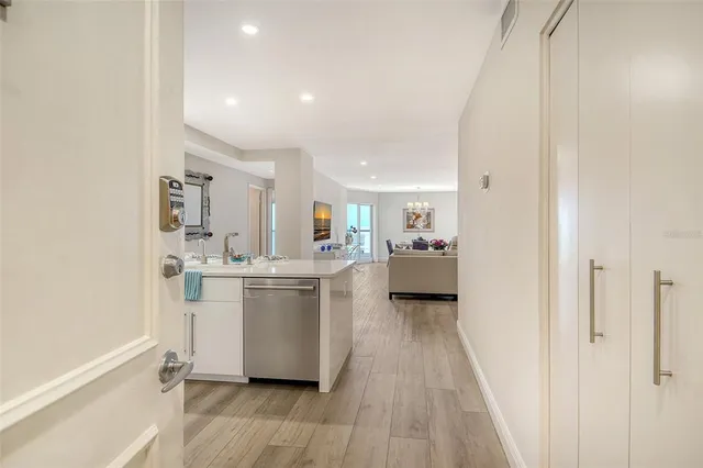 a view of a city from a balcony with furniture