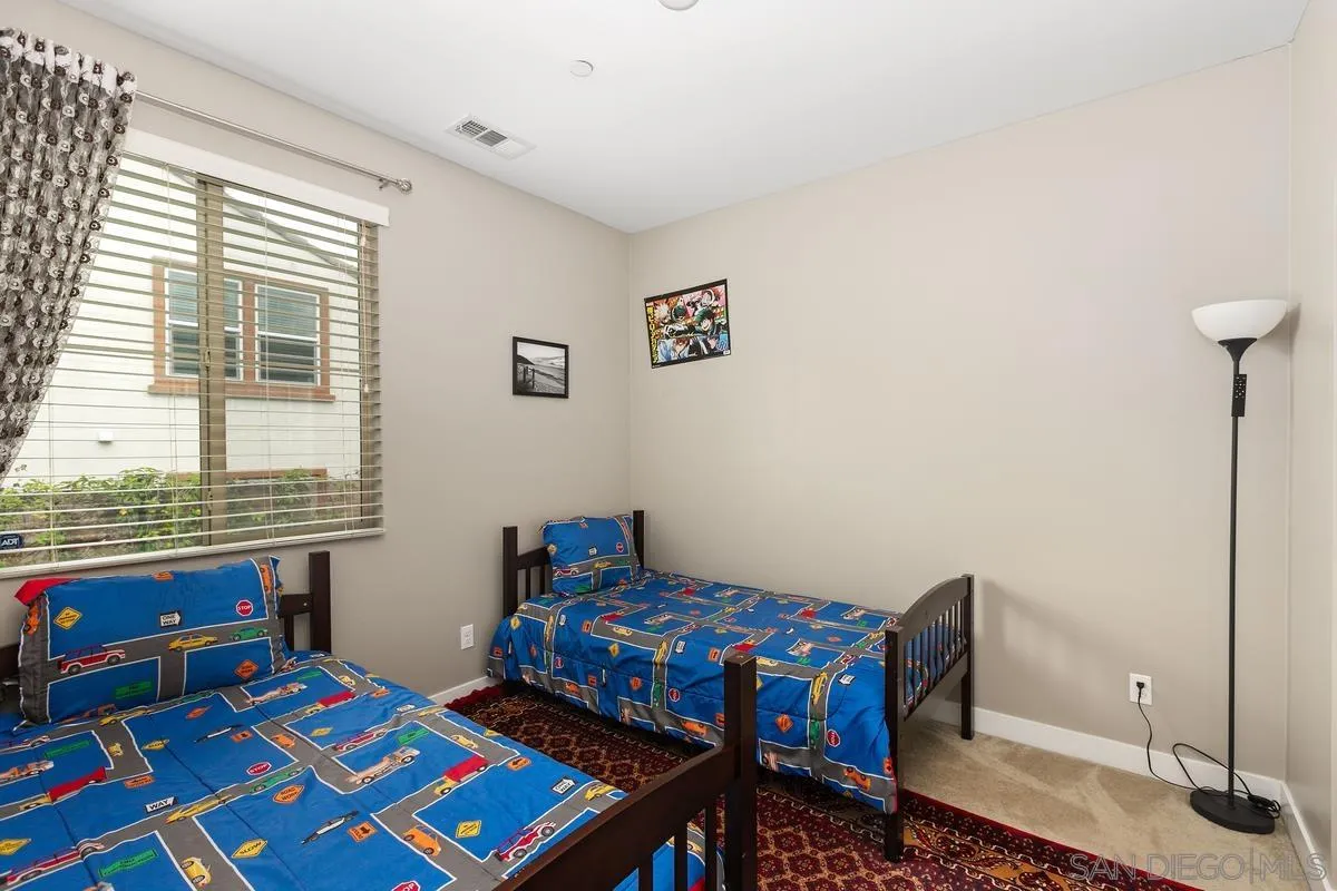 7508 Eagle Drive Santee, CA 92071 - Photo 12 of 22 a bedroom with furniture and a window