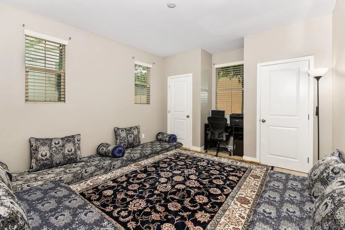 7508 Eagle Drive Santee, CA 92071 - Photo 16 of 22 a bedroom with a bed and a window