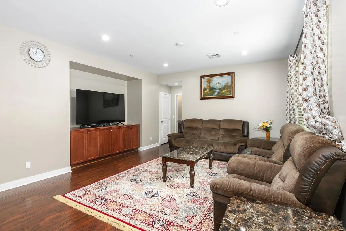 7508 Eagle Drive Santee, CA 92071 - Photo 19 of 22 a living room with furniture and a flat screen tv