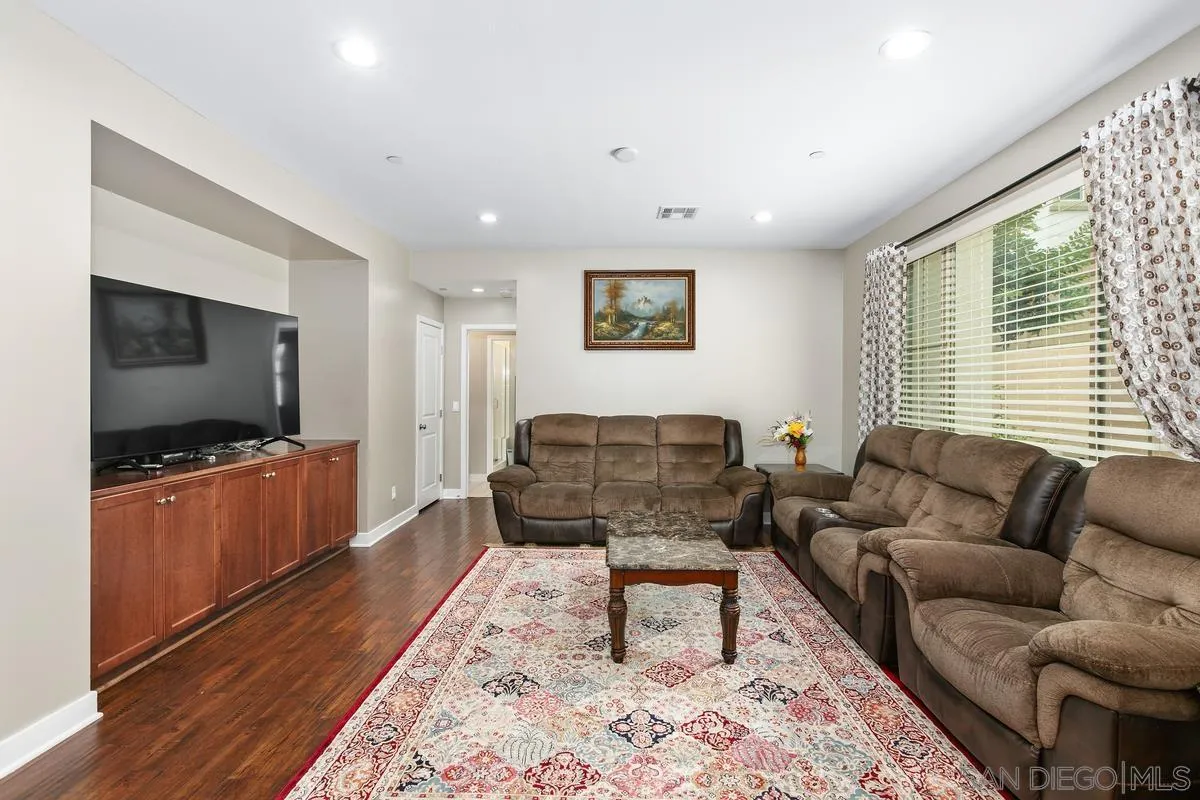 7508 Eagle Drive Santee, CA 92071 - Photo 20 of 22 a living room with furniture and a flat screen tv