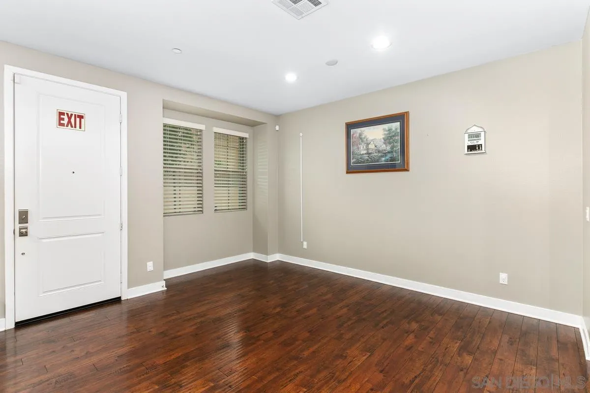7508 Eagle Drive Santee, CA 92071 - Photo 22 of 22 an empty room with wooden floor and windows