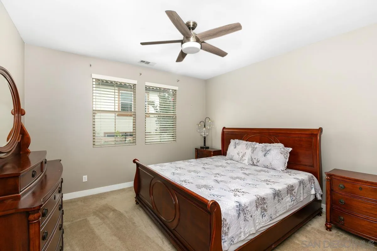 7508 Eagle Drive Santee, CA 92071 - Photo 8 of 22 a bedroom with a bed and window