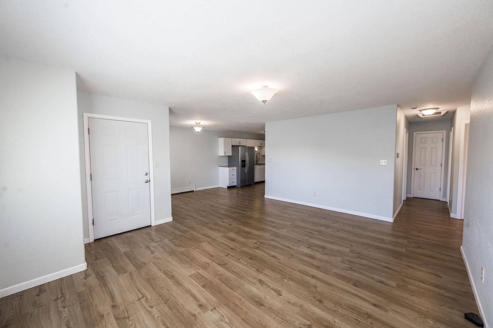 455 David Court Fruita, CO 81521 - Photo 3 of 28 a view of empty room with wooden floor