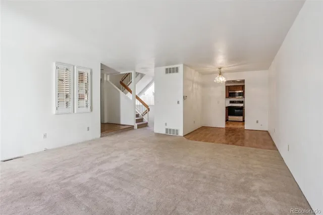 an empty room with a white walls and white walls