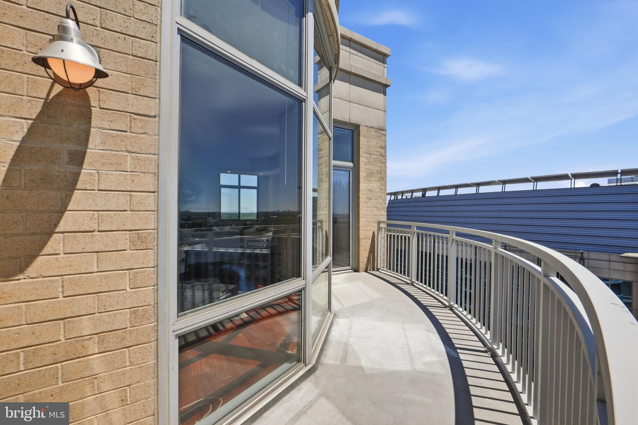 11990 Market Street, Unit 2103 Reston, VA 20190 - Photo 34 of 78 Scenic balcony with panoramic views.