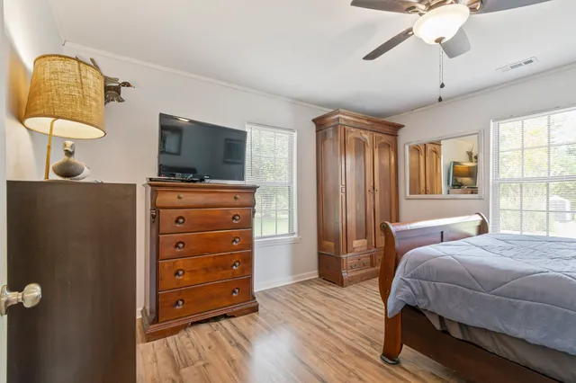 a view of a workspace with furniture and a bookshelf