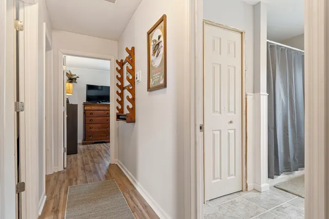 a front view of a house with a garden and yard