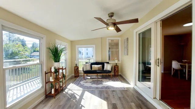 a living room with furniture and a large window