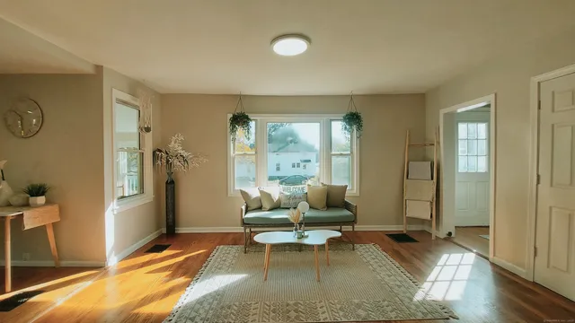 a living room with furniture and a rug