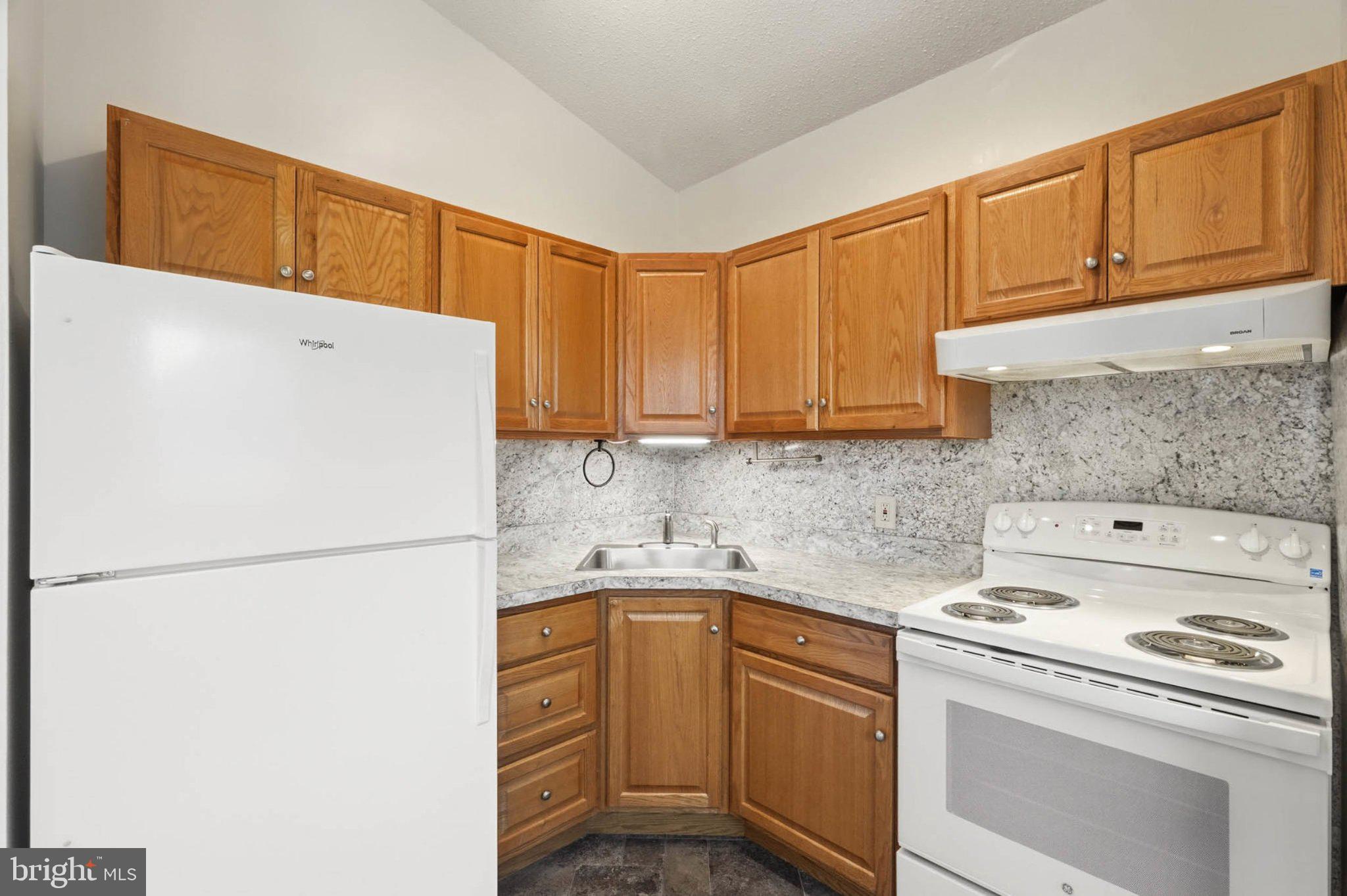 7322 Windsor Mill Road Windsor Mill, MD 21244 - Photo 7 of 34 Cozy kitchen with modern finishes.