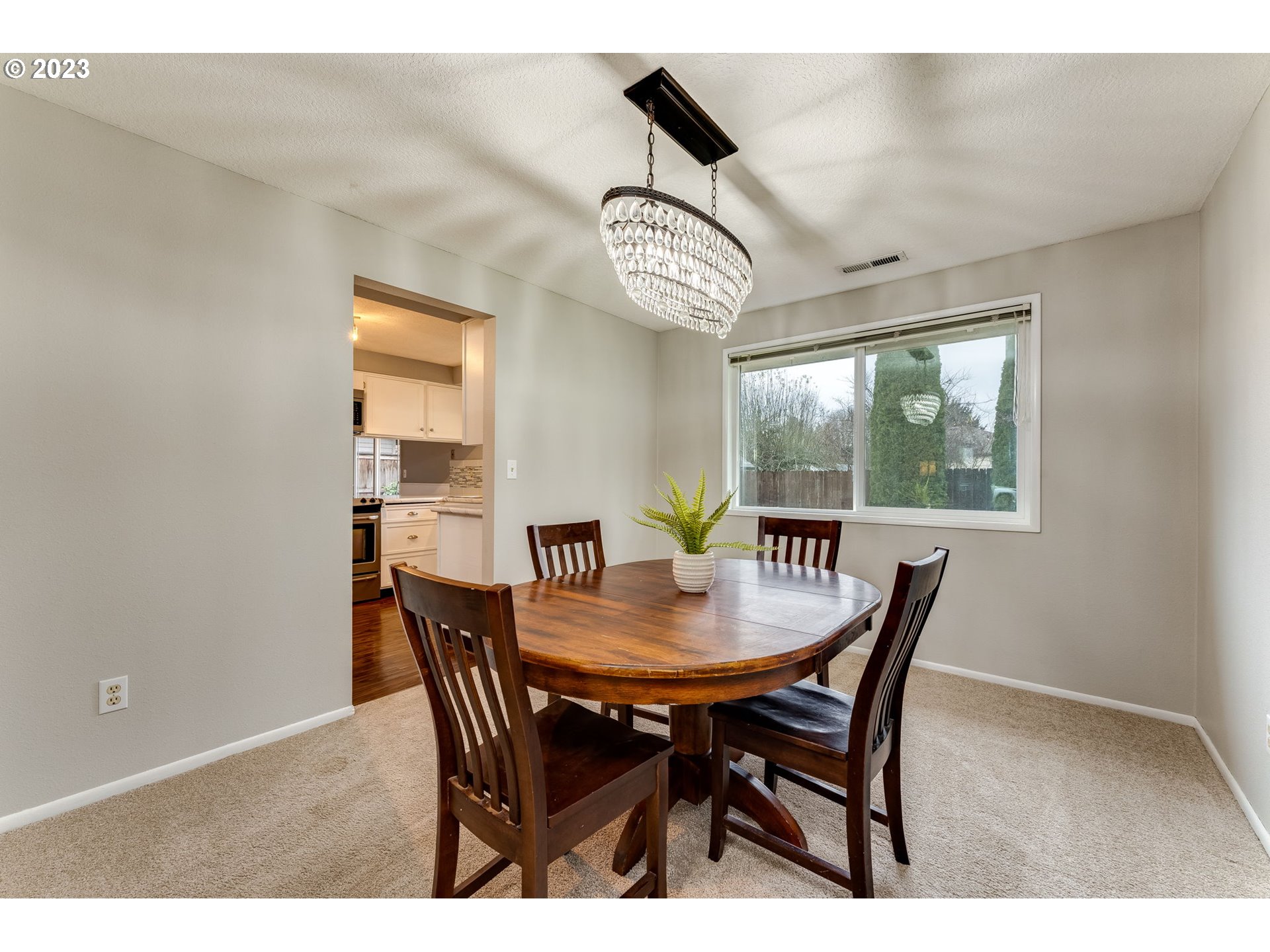 126 Villa Road Kelso, WA 98626 - Photo 11 of 41 a view of a dining room with furniture window and wooden floor