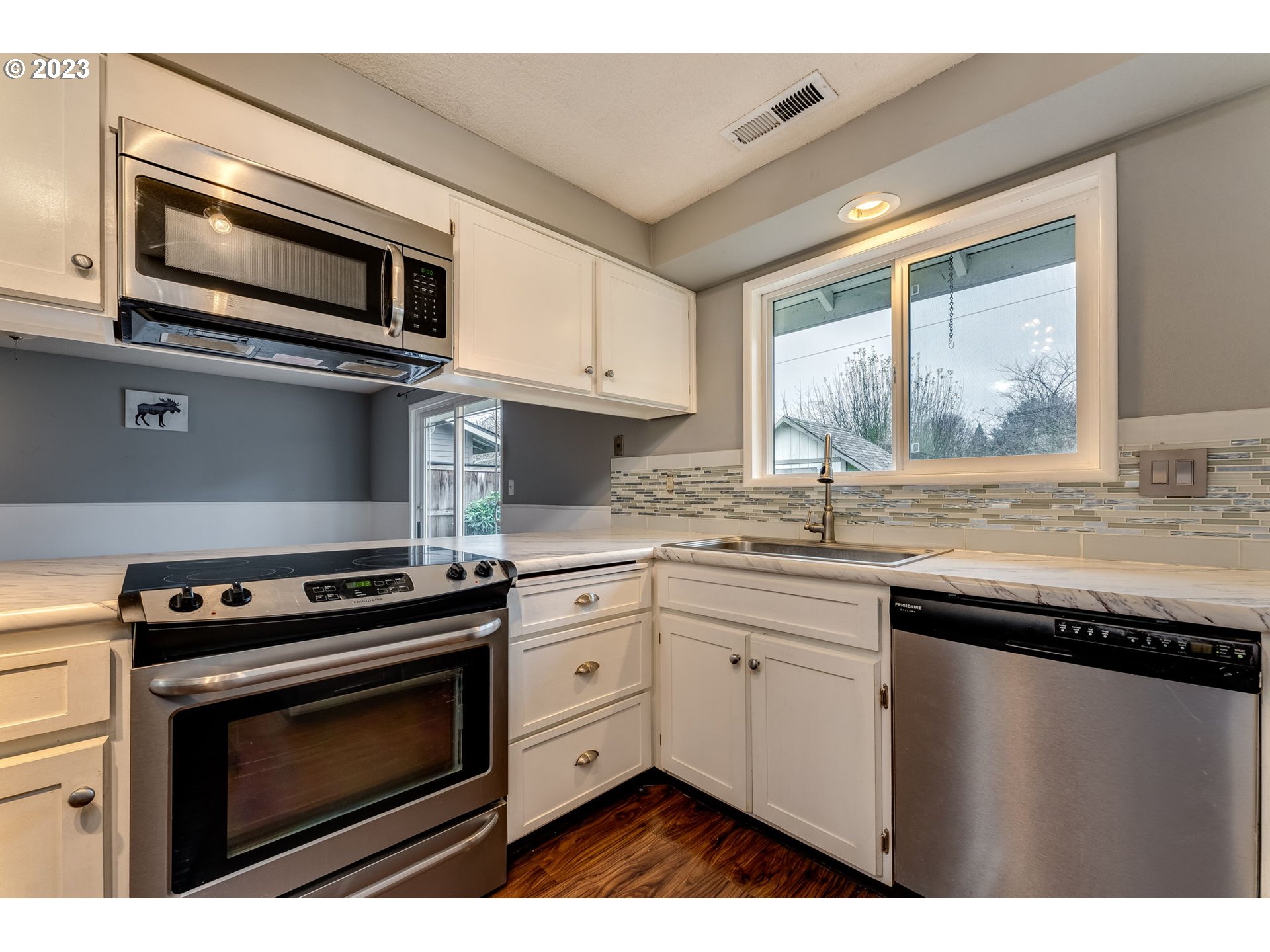 126 Villa Road Kelso, WA 98626 - Photo 14 of 41 a kitchen with stainless steel appliances a stove sink and microwave