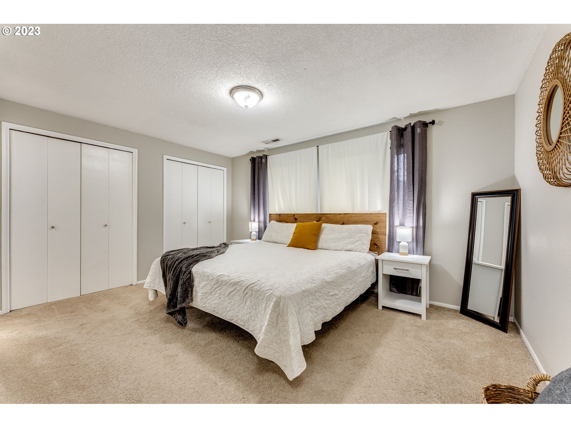 126 Villa Road Kelso, WA 98626 - Photo 24 of 41 a bedroom with a bed and a mirror