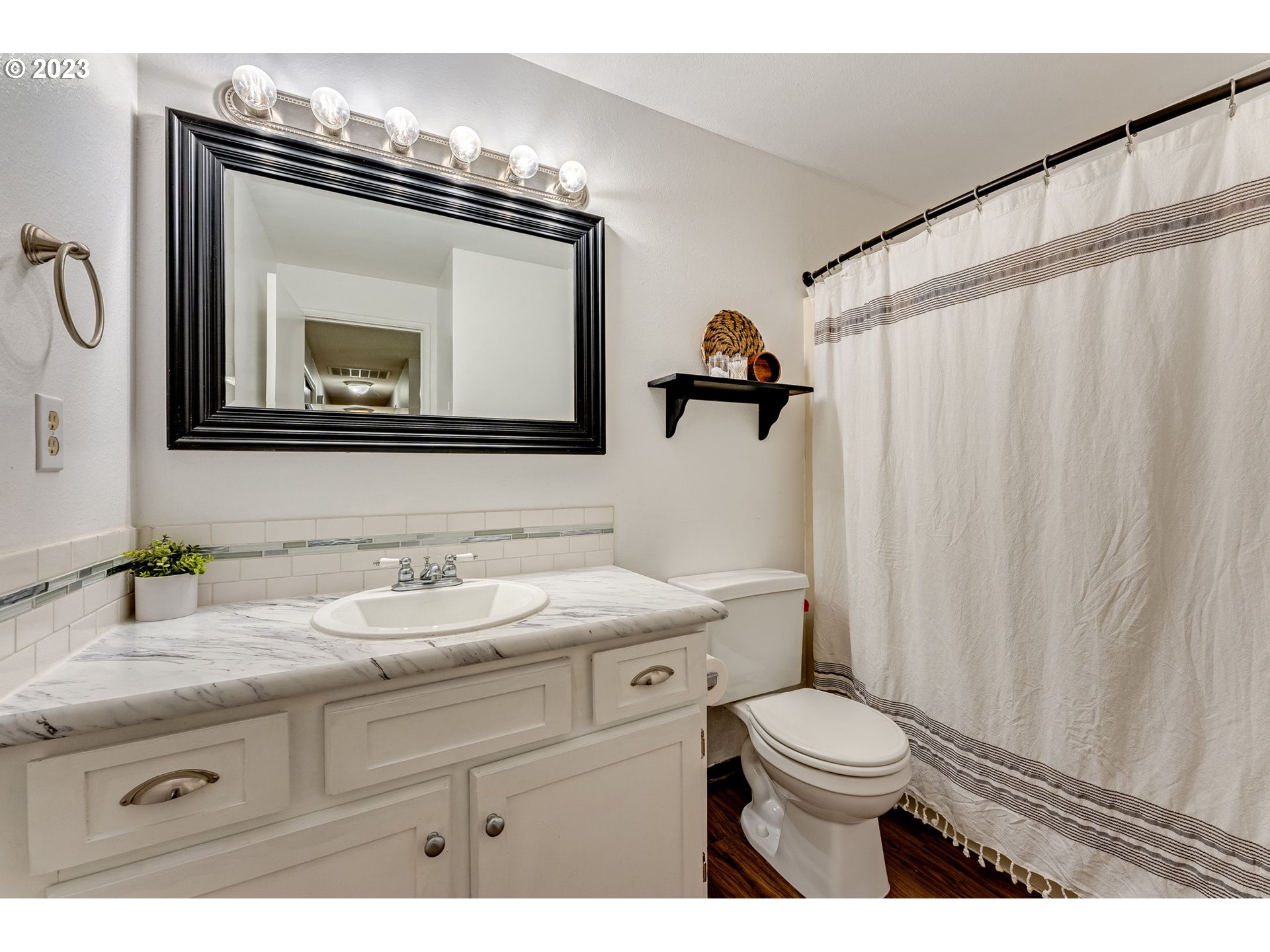 126 Villa Road Kelso, WA 98626 - Photo 31 of 41 a bathroom with a granite countertop toilet sink and mirror