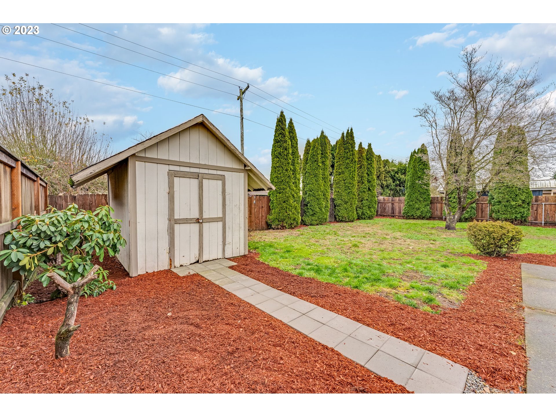 126 Villa Road Kelso, WA 98626 - Photo 33 of 41 a view of a backyard of a house with large trees
