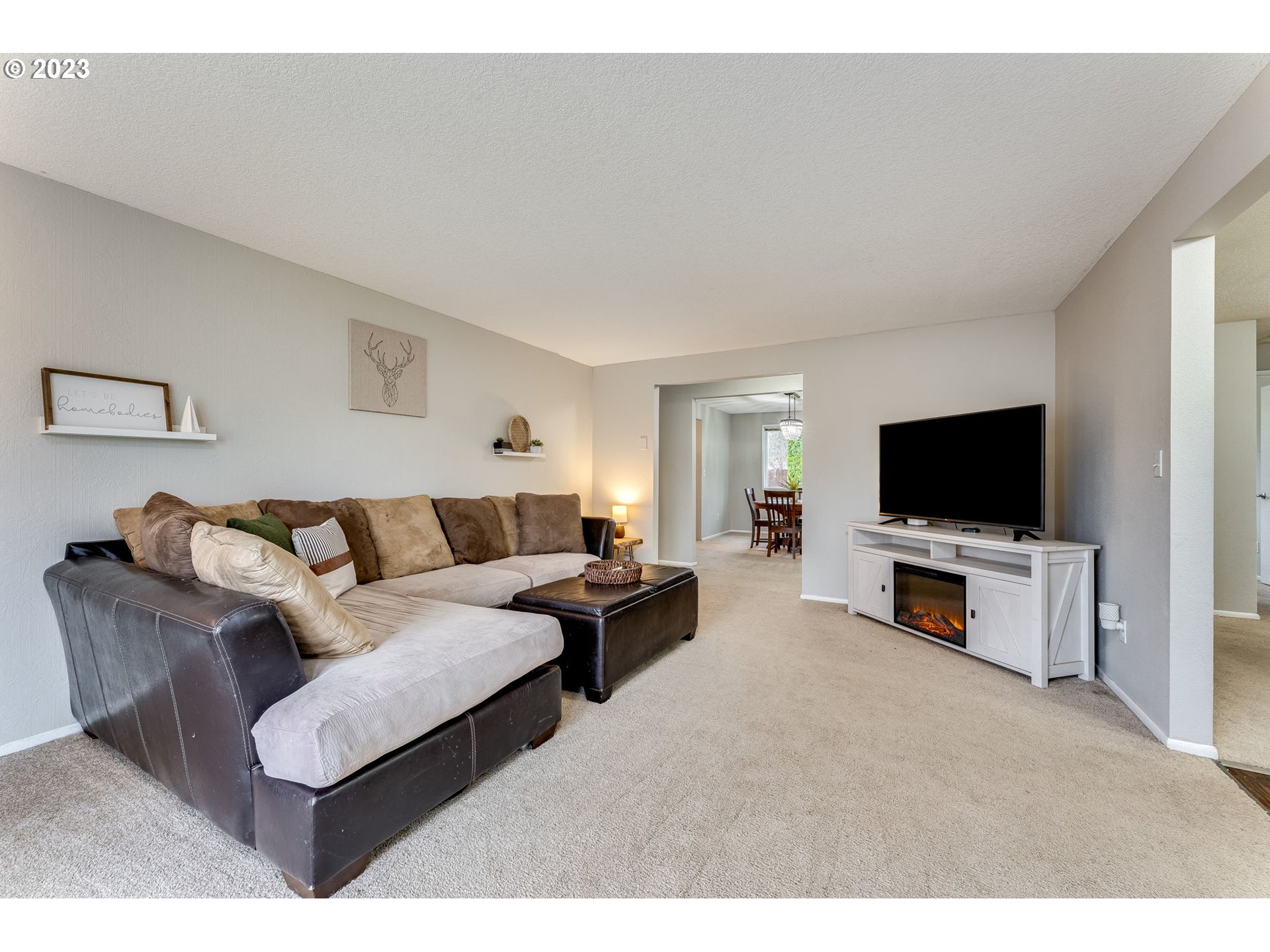126 Villa Road Kelso, WA 98626 - Photo 6 of 41 a living room with furniture and a flat screen tv