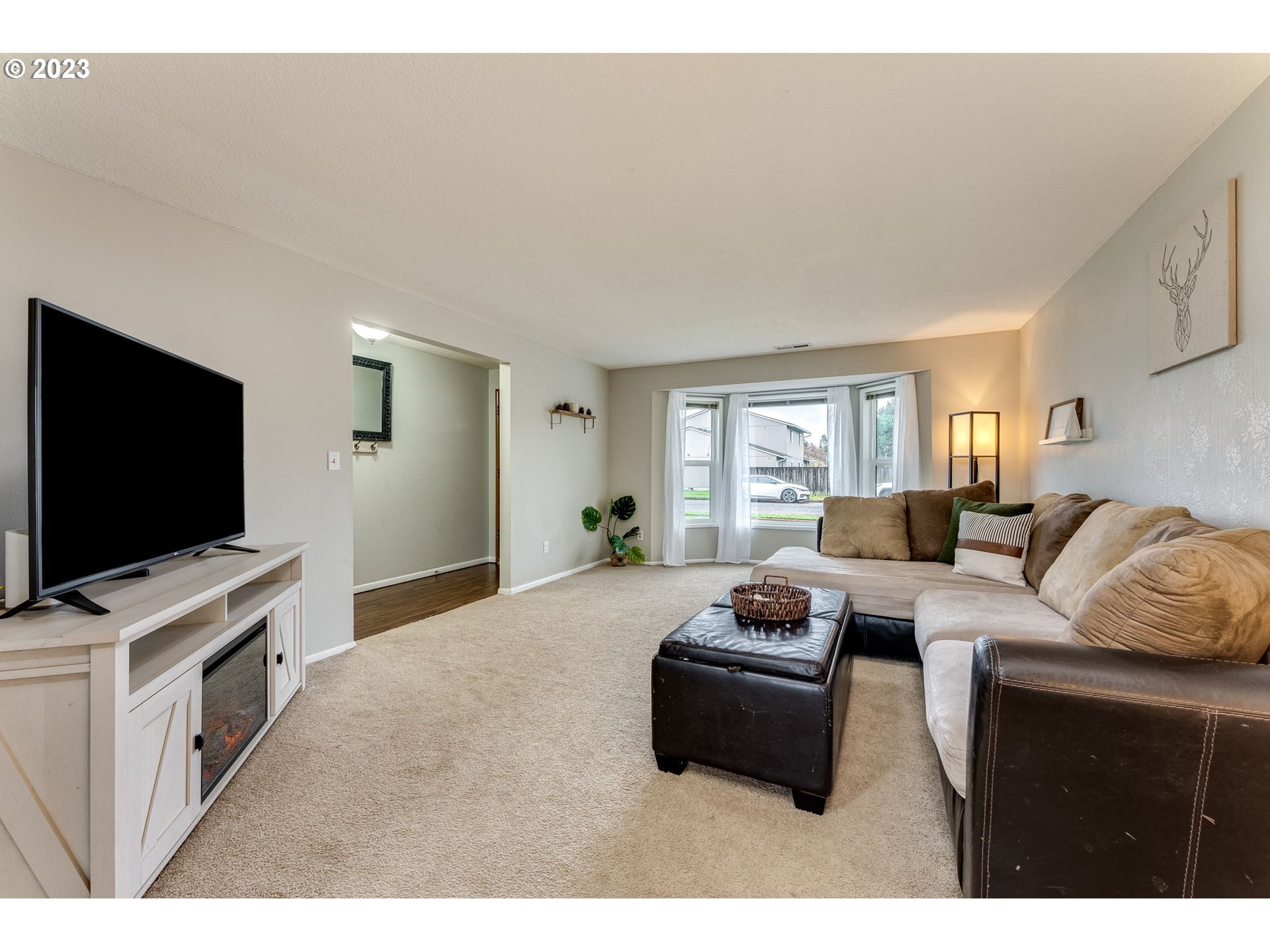 126 Villa Road Kelso, WA 98626 - Photo 8 of 41 a living room with furniture and a flat screen tv