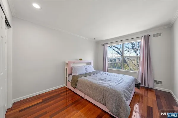 a bedroom with a bed and a table