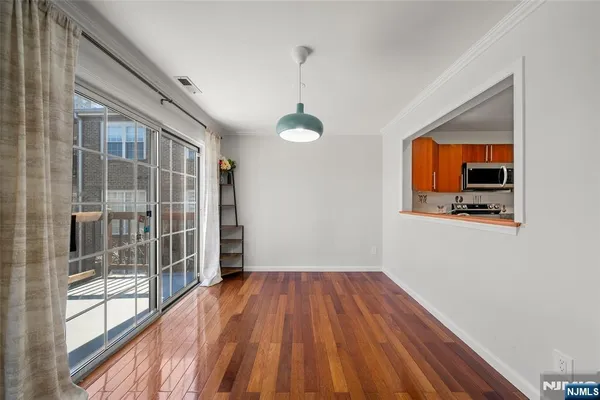 a kitchen with stainless steel appliances granite countertop a refrigerator stove top oven a sink and dishwasher