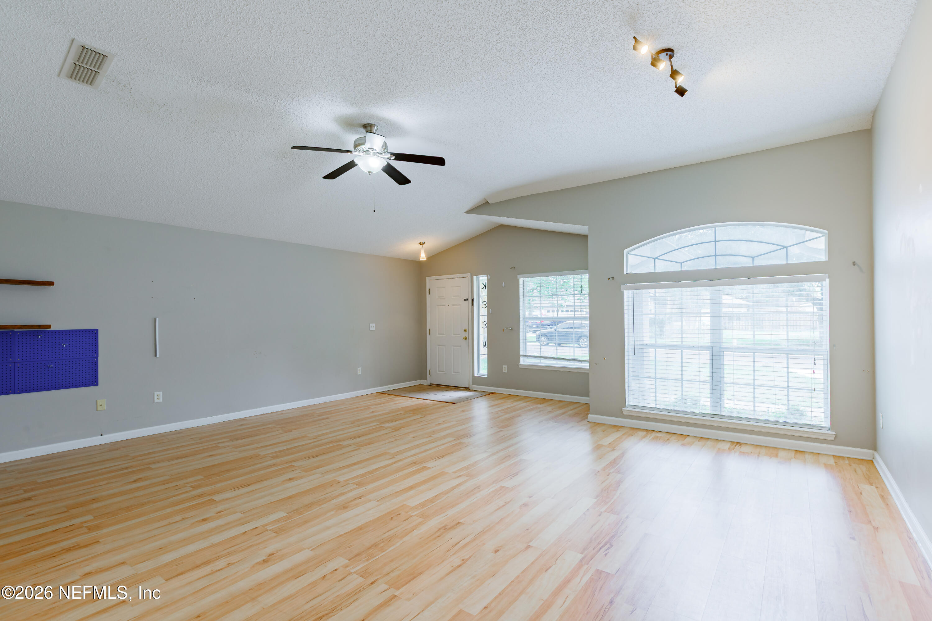 673 MacKenzie Circle St. Augustine, FL 32092 - Photo 11 of 28 wooden floor in an empty room with a window