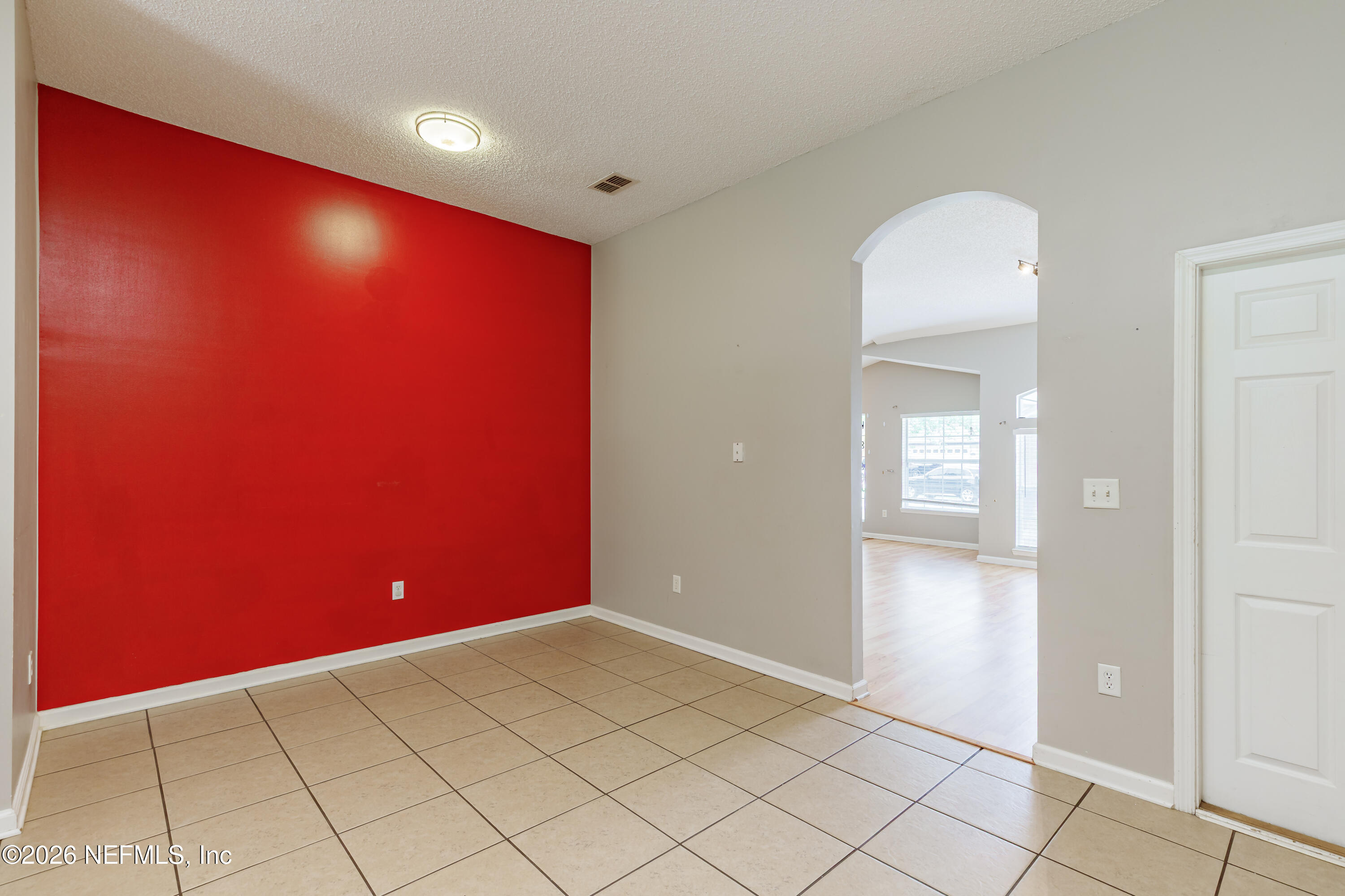673 MacKenzie Circle St. Augustine, FL 32092 - Photo 15 of 28 an empty room with wooden floor and windows