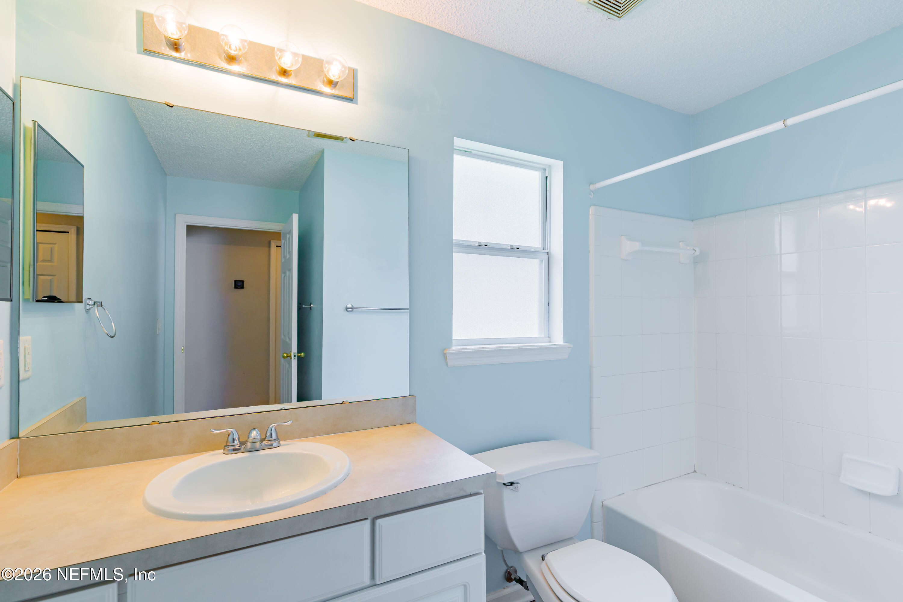673 MacKenzie Circle St. Augustine, FL 32092 - Photo 16 of 28 a bathroom with a granite countertop sink toilet and shower