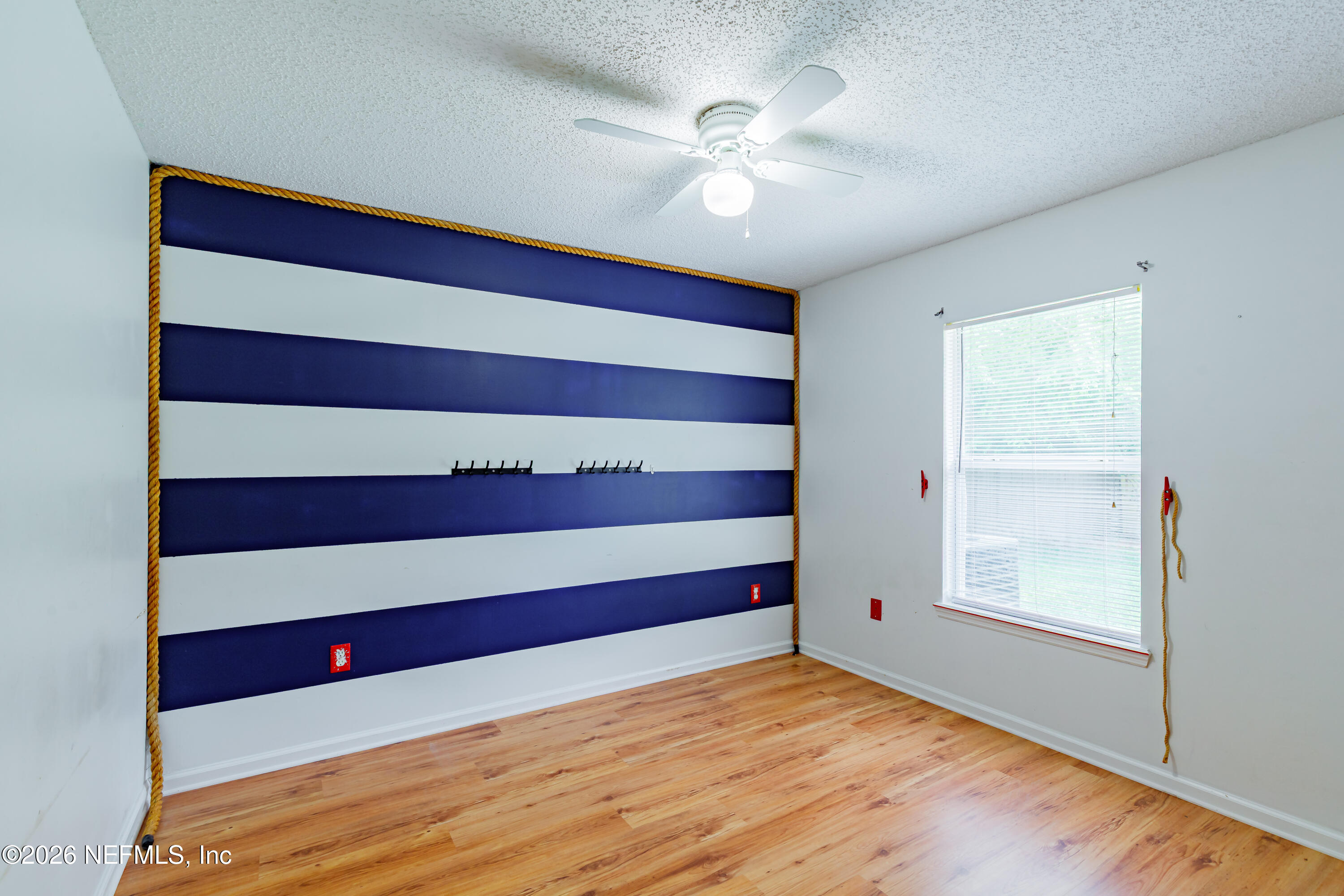 673 MacKenzie Circle St. Augustine, FL 32092 - Photo 17 of 28 a view of empty room with wooden floor and window