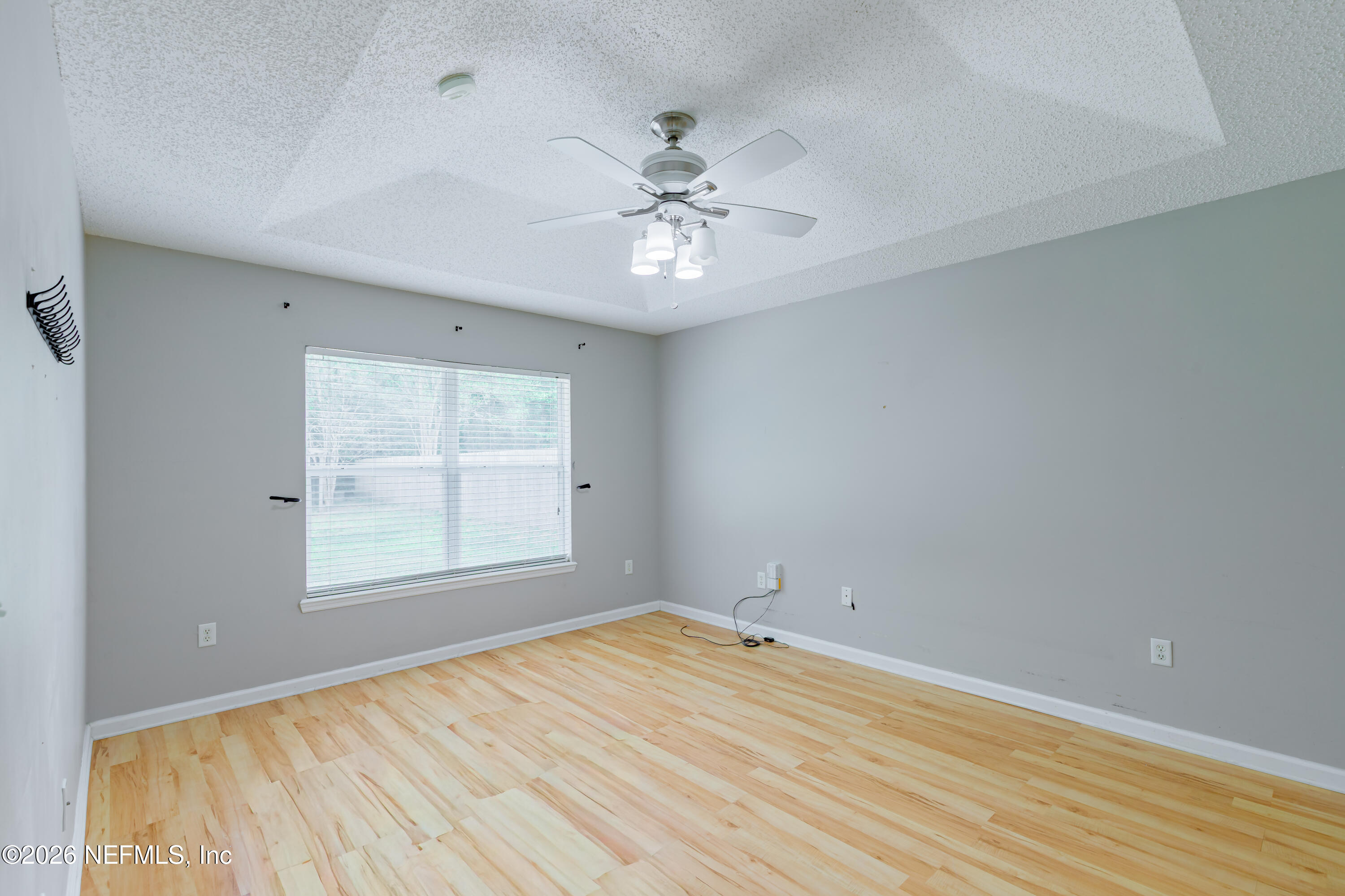673 MacKenzie Circle St. Augustine, FL 32092 - Photo 19 of 28 an empty room with a window and ceiling fan