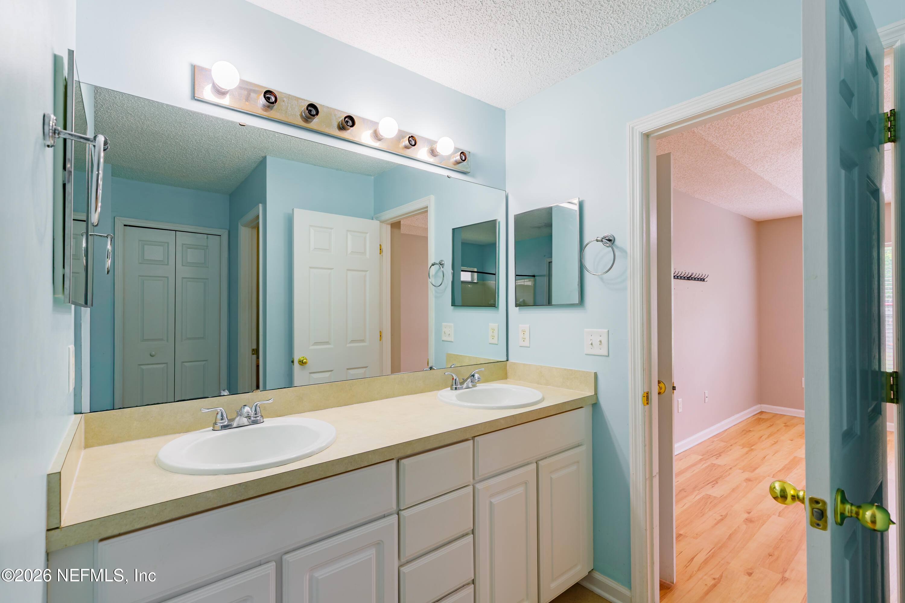 673 MacKenzie Circle St. Augustine, FL 32092 - Photo 24 of 28 a bathroom with a sink and a mirror