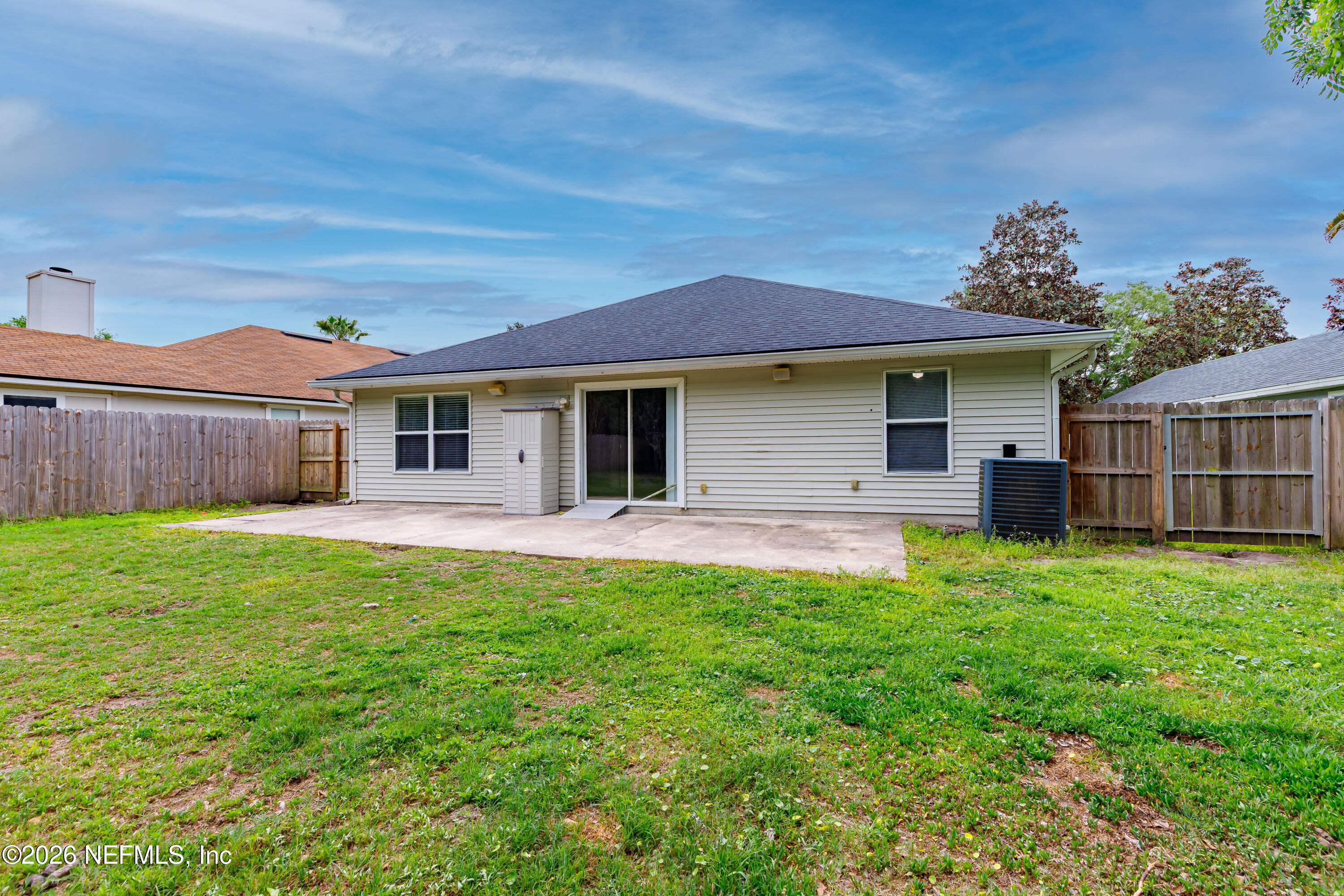 673 MacKenzie Circle St. Augustine, FL 32092 - Photo 25 of 28 a front view of a house with a yard