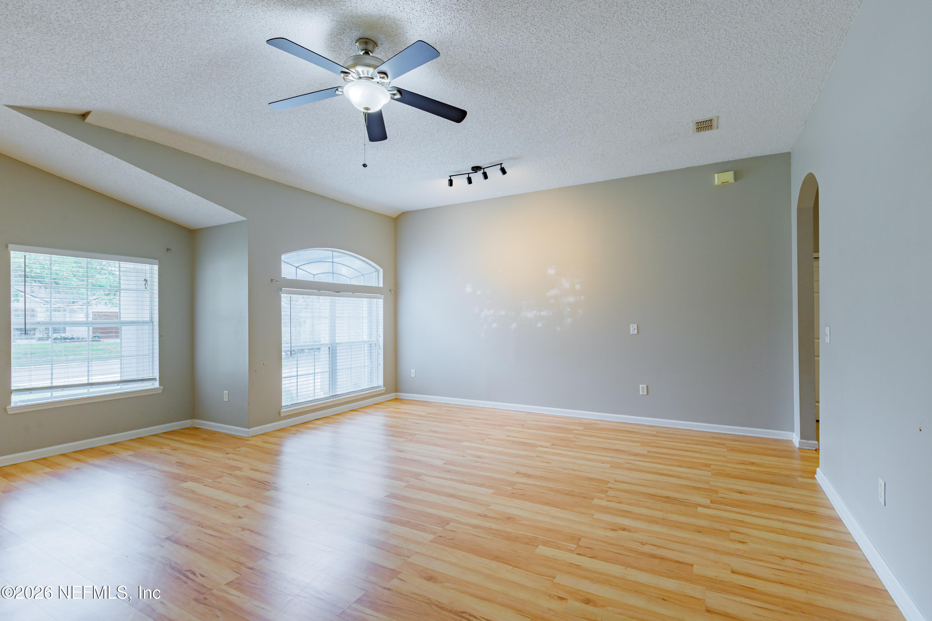673 MacKenzie Circle St. Augustine, FL 32092 - Photo 5 of 28 a view of an empty room with window and wooden floor