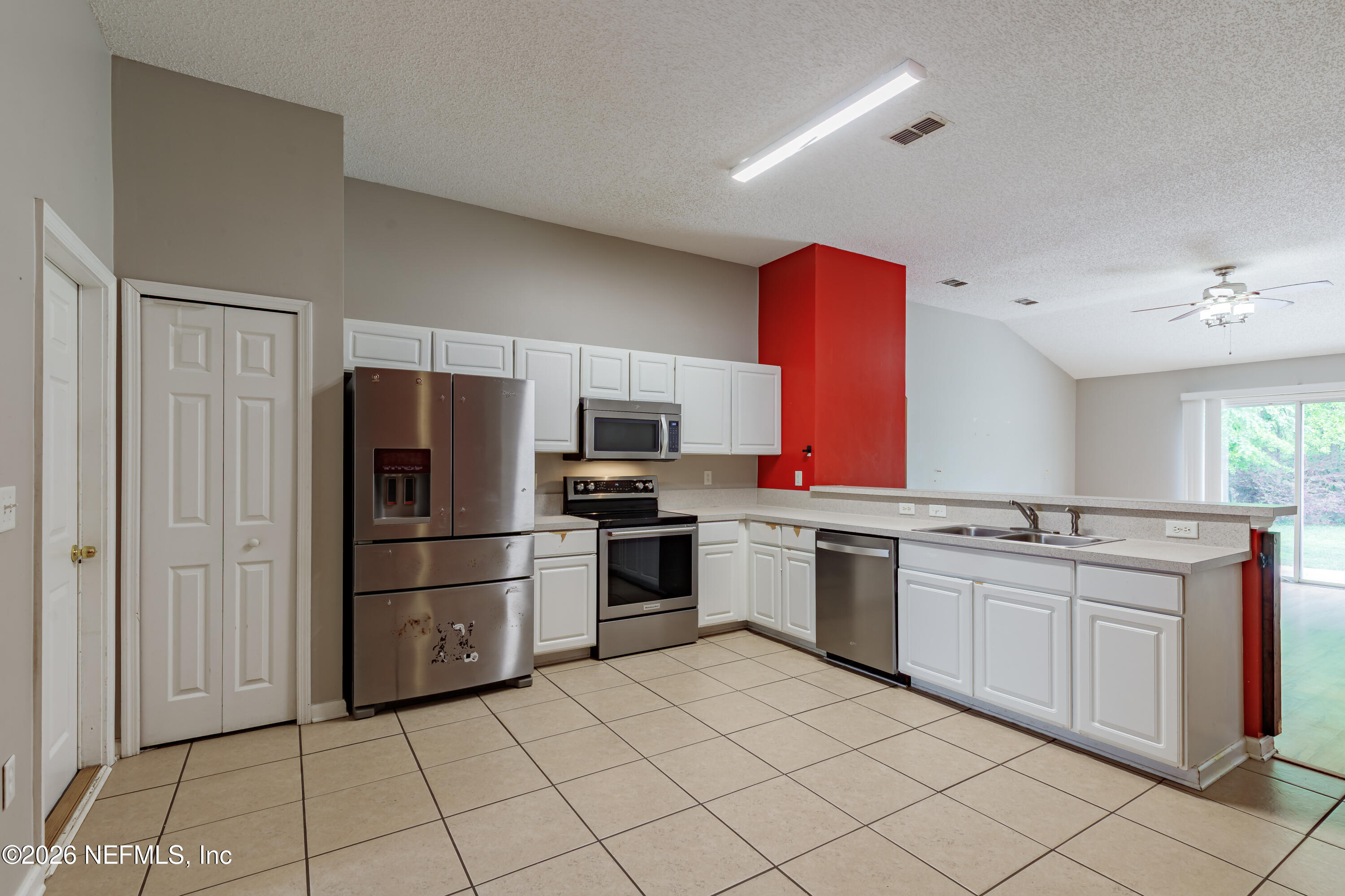 673 MacKenzie Circle St. Augustine, FL 32092 - Photo 6 of 28 a kitchen with stainless steel appliances granite countertop a refrigerator and a stove top oven
