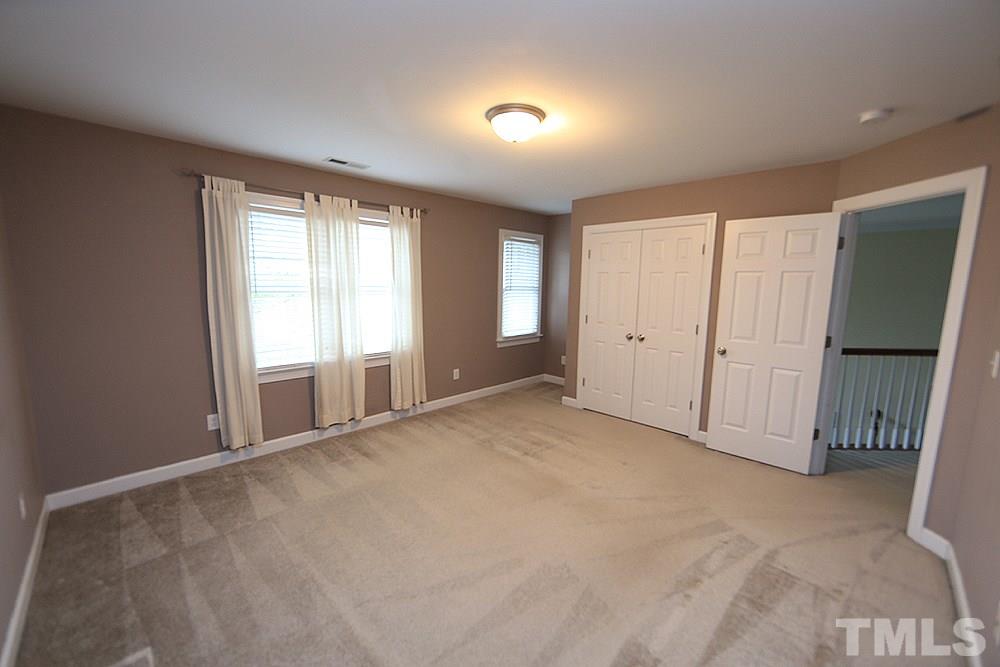 2108 Karns Place Raleigh, NC 27614 - Photo 14 of 26 an empty room with windows