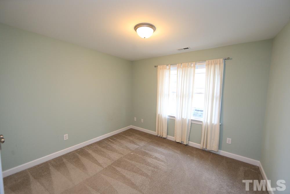 2108 Karns Place Raleigh, NC 27614 - Photo 15 of 26 an empty room with windows and closet